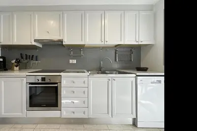 Una cocina o zona de cocina en LETS HOLIDAYS Big Apartment With Parking