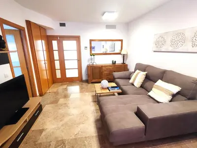 Una televisión o centro de entretenimiento en Apartamento a 150m de la playa