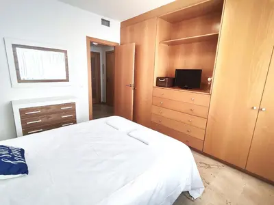 Cama o camas de una habitación en Apartamento a 150m de la playa