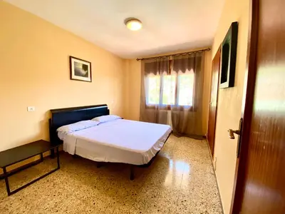 Cama o camas de una habitación en Casa con vistas al mar y piscina privada