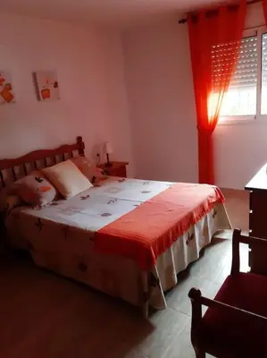 Cama o camas de una habitación en Apartment mit Bergblickterrasse bei Lloret de Mar
