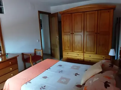 Cama o camas de una habitación en Apartment mit Bergblickterrasse bei Lloret de Mar