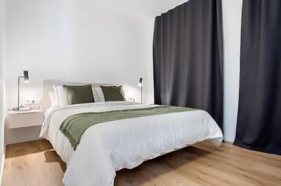 Cama o camas de una habitación en Hauzify I Apartaments Voramar