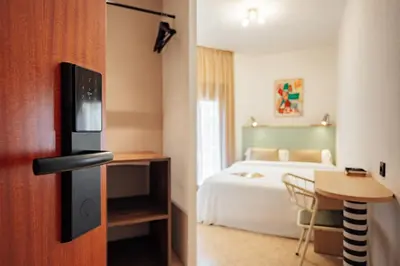 Cama o camas de una habitación en Hotel Robson - Smart Hotel
