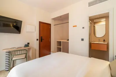 Cama o camas de una habitación en Hotel Robson - Smart Hotel