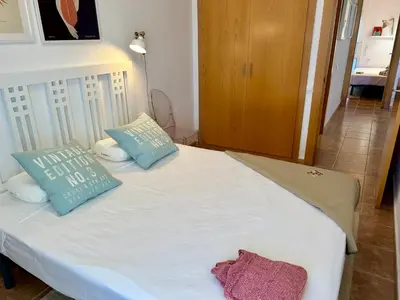 Cama o camas de una habitación en Apartament reformat, Wi Fi, parking, piscina, AC
