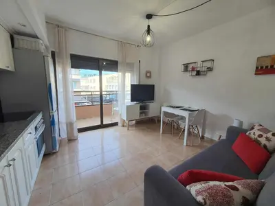 Una televisión o centro de entretenimiento en Costa Brava Suites Apartamento Neptuno