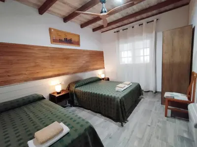 Cama o camas de una habitación en VILLA MasÍa CAL TONI
