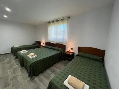 Cama o camas de una habitación en VILLA MasÍa CAL TONI