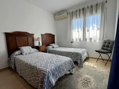 Cama o camas de una habitación en Casa Judibar con zona de barbacoa y piscina