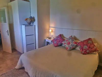 Cama o camas de una habitación en Preciosa casa al borde de un acantilado