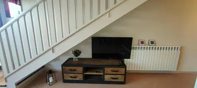 Una televisión o centro de entretenimiento en Apartamento Duplex Mar&Pol gran terraza