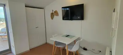 Una televisión o centro de entretenimiento en Apartamento Loft Mar&Pol