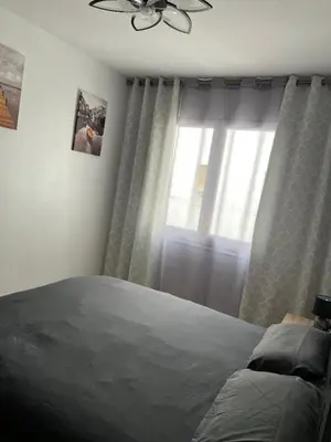 Cama o camas de una habitación en Logement avec vue latérale mer