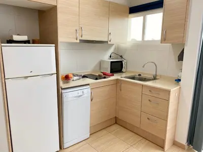 Una cocina o zona de cocina en Apart. comfortable i modern Calella de Palafrugell, Wi-Fi, piscina