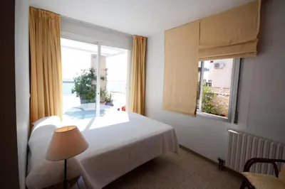 Cama o camas de una habitación en Apartamentos Siglo XXI - Marabu