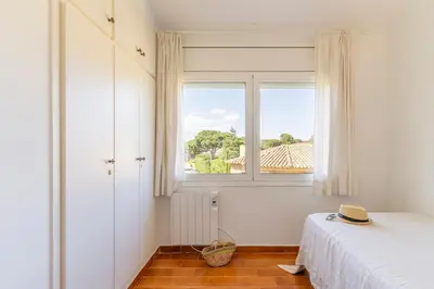 Cama o camas de una habitación en Apartamento Calella Park parking y piscina - WeHost Costa Brava