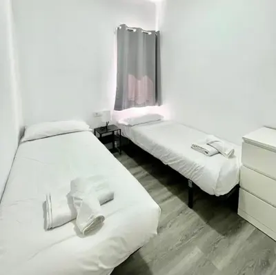 Cama o camas de una habitación en SeaHomes Vacations - CENTRIC APT TOSSA DE MAR