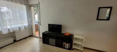 Una televisión o centro de entretenimiento en Antillas Fenals Apartment in Lloret de Mar