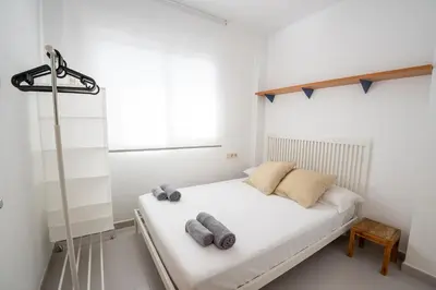 Cama o camas de una habitación en Penthouse Fenals Beach