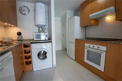 Una cocina o zona de cocina en Penthouse Fenals Beach