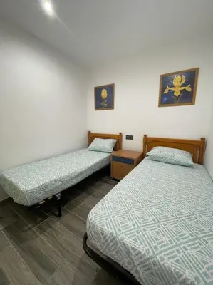 Cama o camas de una habitación en Céntrico Apartmento
