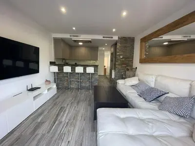 Una televisión o centro de entretenimiento en Céntrico Apartmento