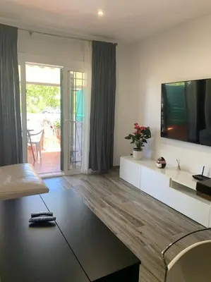 Una televisión o centro de entretenimiento en Céntrico Apartmento