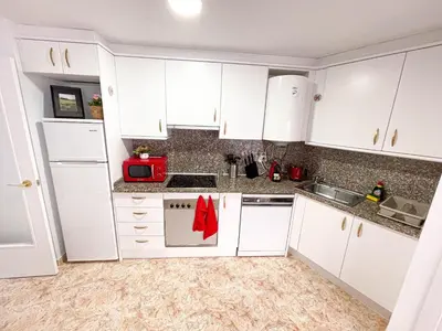 Una cocina o zona de cocina en Red Apartment Lloret