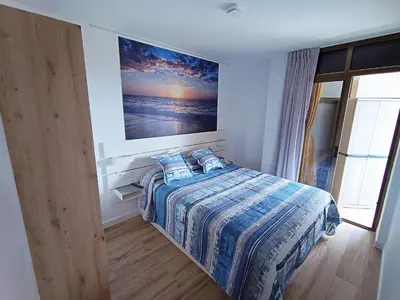 Cama o camas de una habitación en Apartamento nuevo en Calella totalmente reformado con Parking privado
