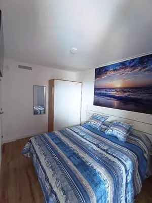 Cama o camas de una habitación en Apartamento nuevo en Calella totalmente reformado con Parking privado