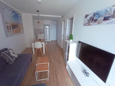 Una televisión o centro de entretenimiento en Apartamento nuevo en Calella totalmente reformado con Parking privado