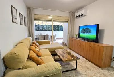 Una televisión o centro de entretenimiento en NEXTHOME Terrace & Boulevard City Center