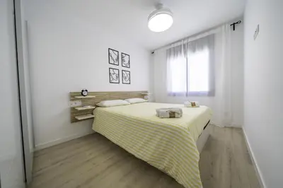 Cama o camas de una habitación en HomeHolidaysRentals Kala - Costa Barcelona