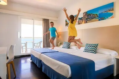 Cama o camas de una habitación en htop Caleta Palace #htopBliss