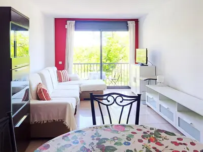 Una televisión o centro de entretenimiento en Apartamento en alquiler turístico en Girona ciudad