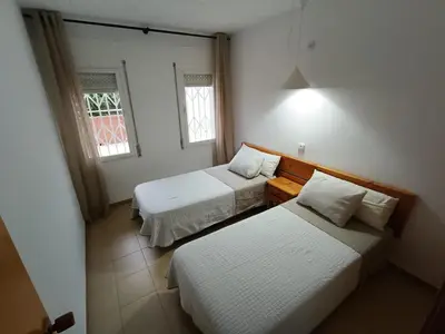Cama o camas de una habitación en APCOSTAS Els Pins Lotus