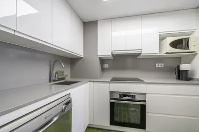 Una cocina o zona de cocina en HomeholidayRentals Singular - Costa Barcelona