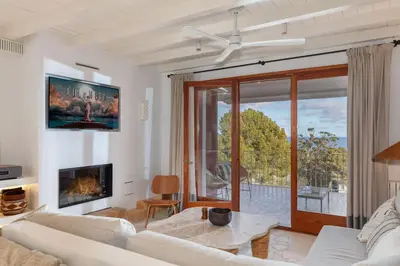 Una televisión o centro de entretenimiento en Apartamento de diseño MAREA ALTA