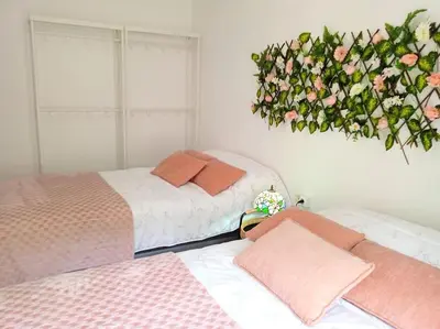 Cama o camas de una habitación en GARDEN'S SEA PiNEDA DE MAR