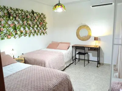 Cama o camas de una habitación en GARDEN'S SEA PiNEDA DE MAR