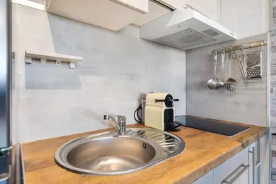 Una cocina o zona de cocina en WELCS ESTUDIO 156 PDA en el centro
