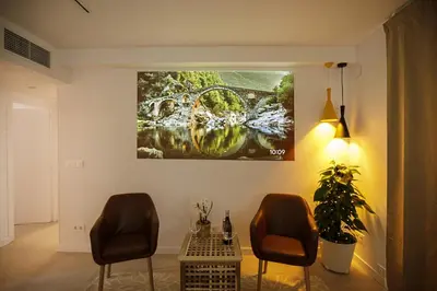 Una televisión o centro de entretenimiento en Apartamento de tres habitaciones en Girona
