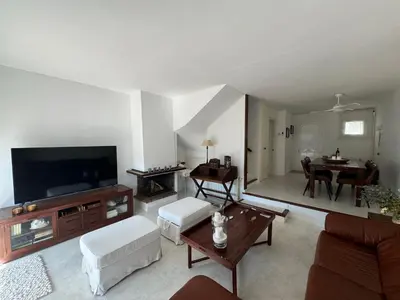 Una televisión o centro de entretenimiento en Casa Adosada S'Agaró