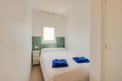 Cama o camas de una habitación en Apartamentos Mediterrani