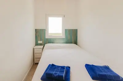 Cama o camas de una habitación en Apartamentos Mediterrani