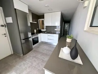 Una cocina o zona de cocina en Apartamento en primera linea con vistas al mar - VistaMar Blanes