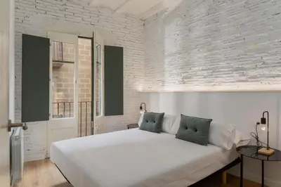 Cama o camas de una habitación en Flateli Sant Agustí