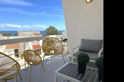 Un balcón o terraza de LETS HOLIDAYS House beach in Cala Salions