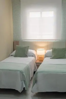 Cama o camas de una habitación en Casa para 8 personas con jardin